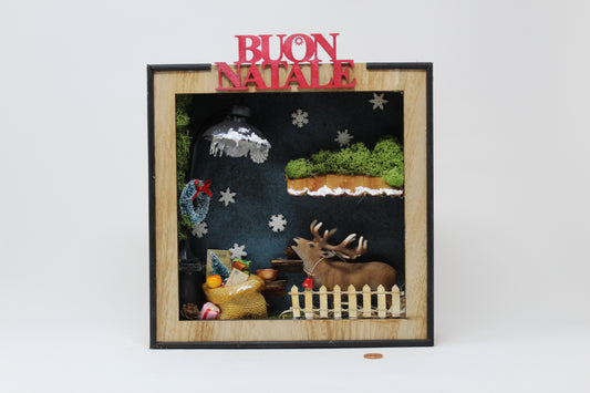 cornice con renna e scritta "buon natale"